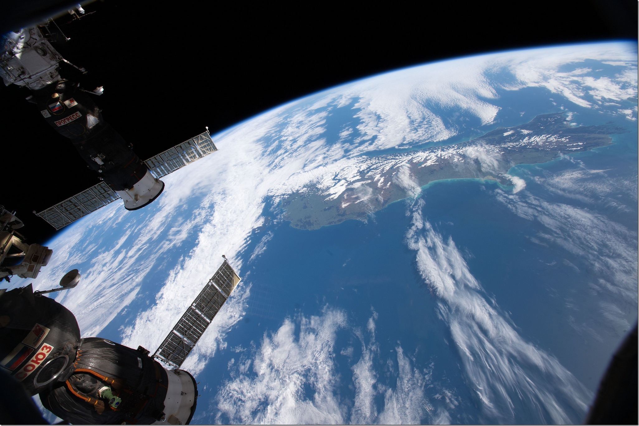 Two Russian spacecraft docked to the International Space Station, (bottom left) the Soyuz MS-09 crew ship and (top left) the Progress 70 cargo craft, are pictured as the orbital complex orbited nearly 262 miles above New Zealand. Credits: NASA