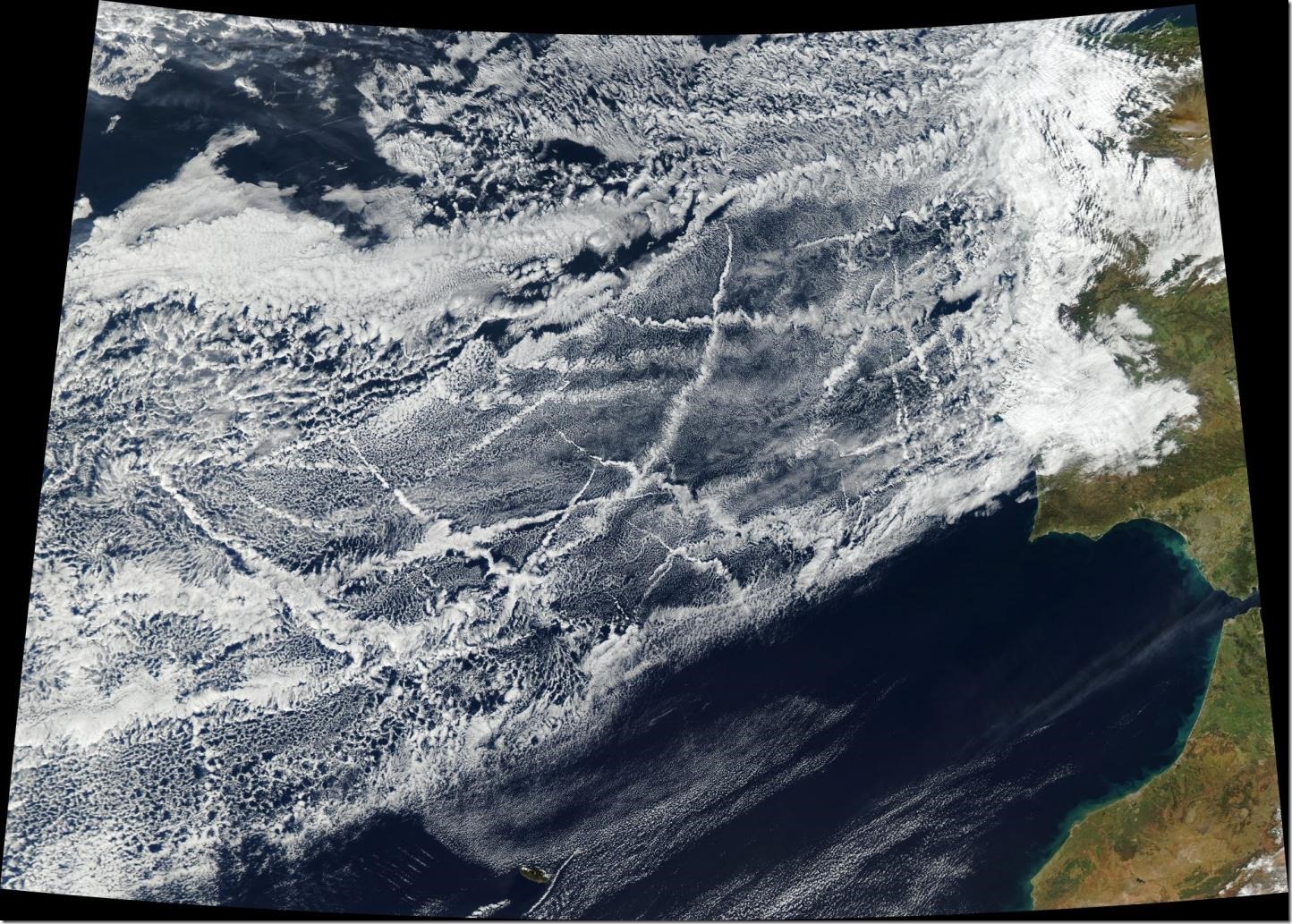 This satellite image was taken January 16, 2018, off the coast of Europe. Pollution from ships creates lines of clouds that can stretch hundreds of miles. The narrower ends of the clouds are youngest, while the broader, wavier ends are older. Credit NASA Earth Observatory